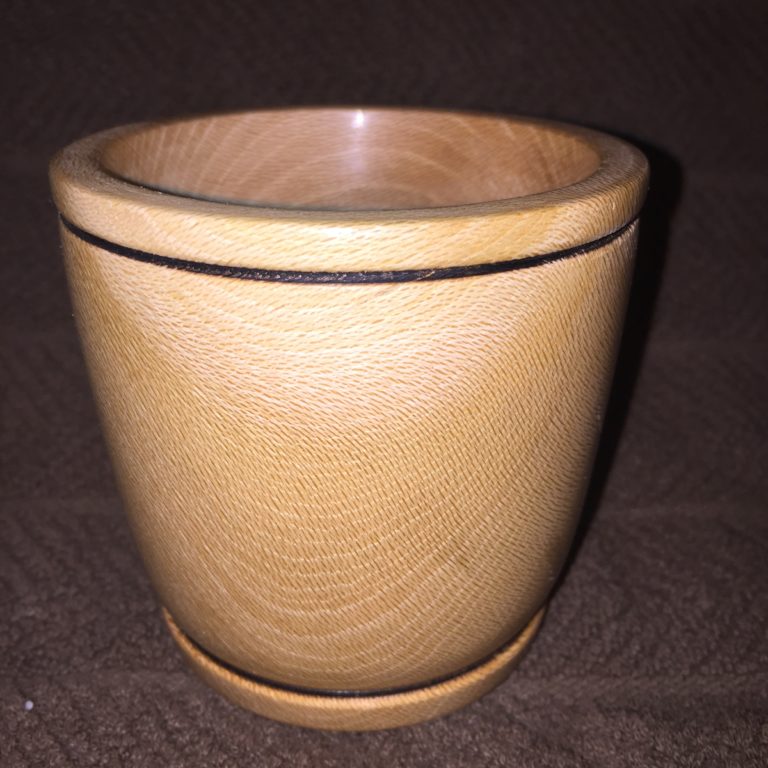 This is made out of plum. I love all those little brown lines that cross the growth rings. Haven't seen other wood that looks like that, with the possible exception of sycamore.